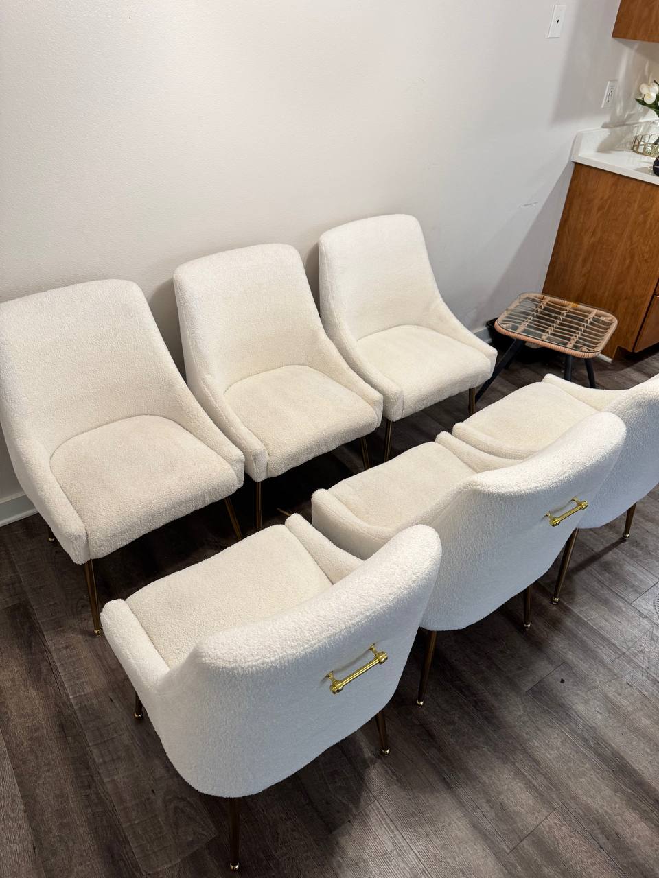 White boucle dining chairs before professional upholstery cleaning in Kirkland WA